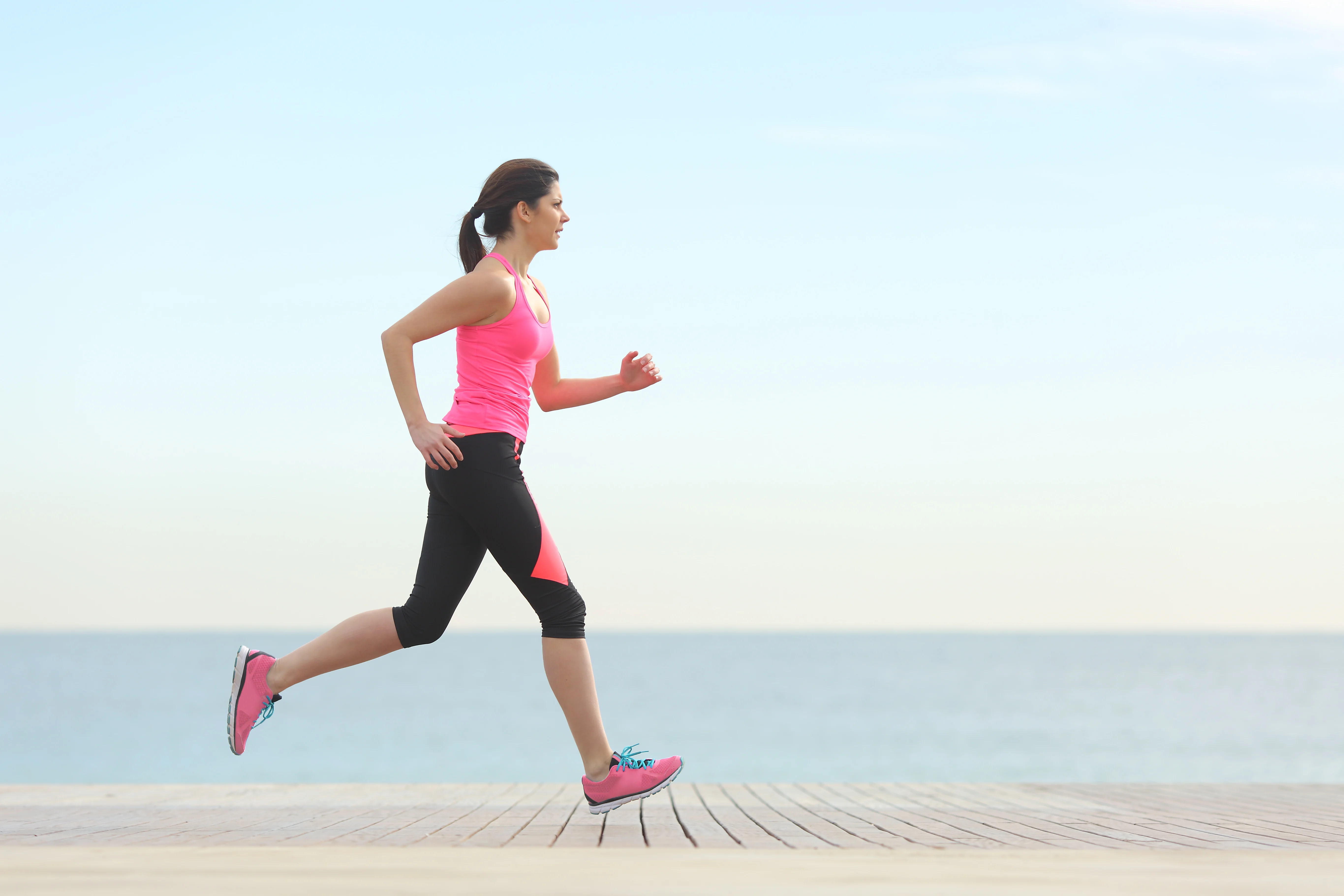 Girl running near the sea