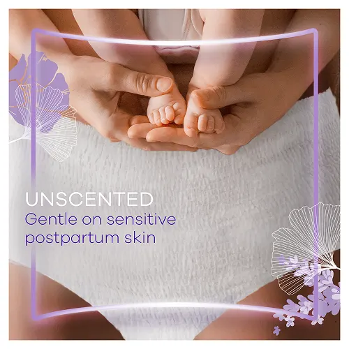 Mum holding her baby's feet wearing unscented postpartum pants