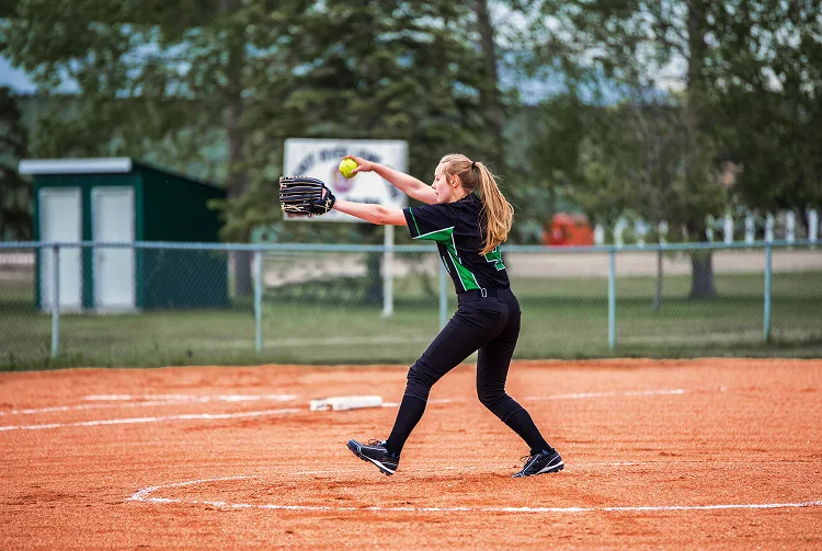 Girl playing baseball