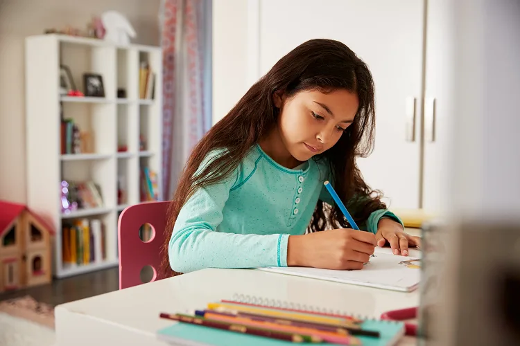 Girl writing in notebook