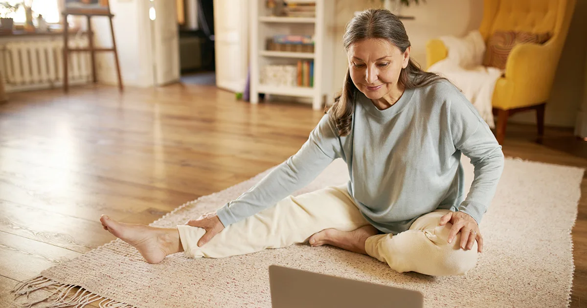 Middle aged woman practicing on the floor