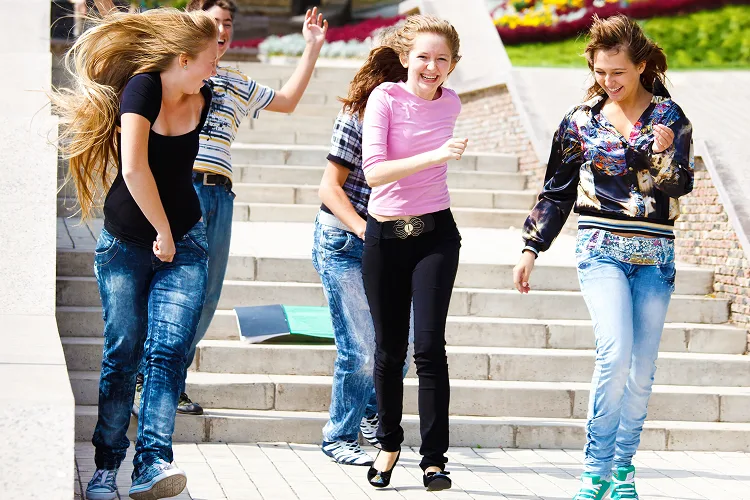 Girls running and laughing
