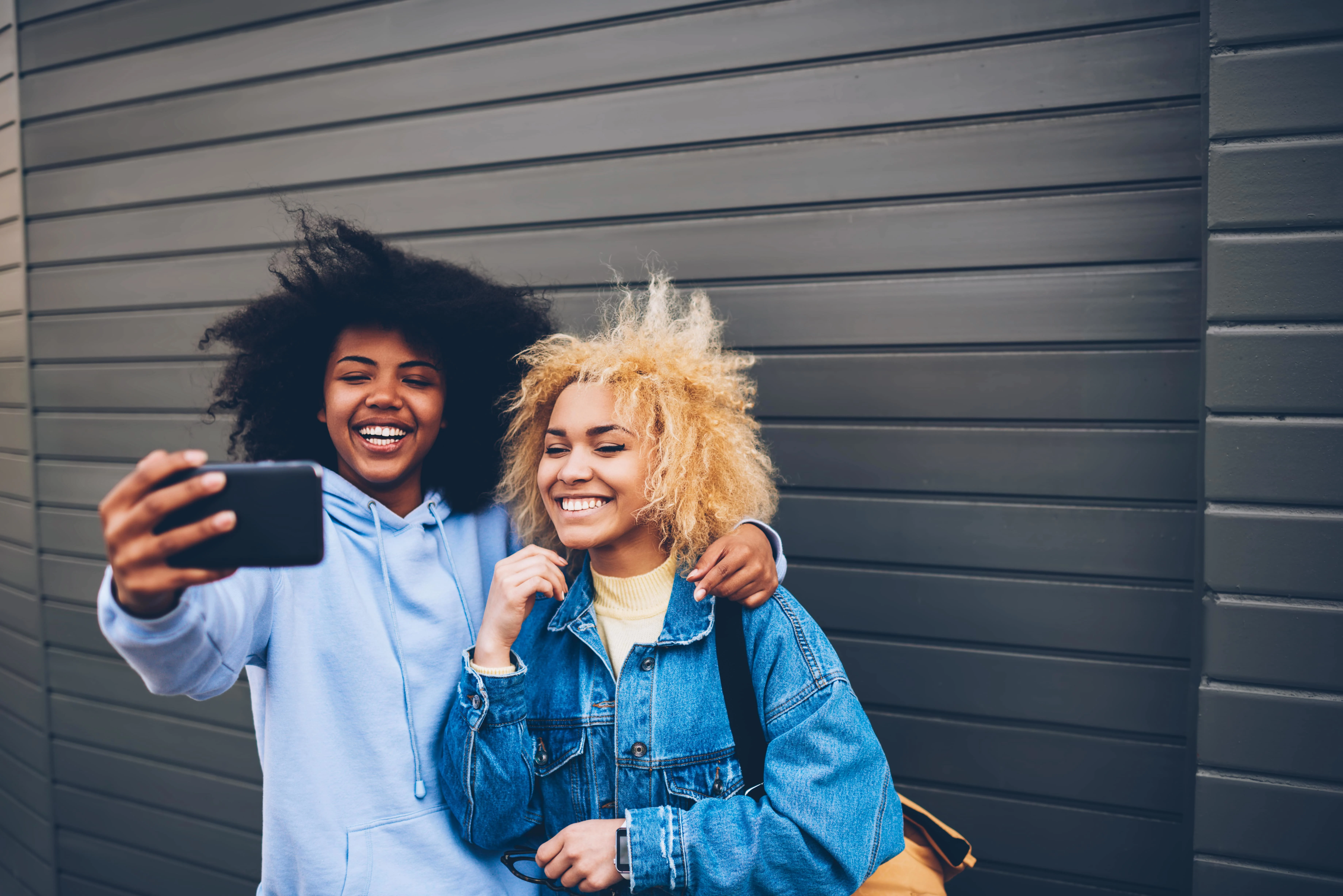 Girls smiling and taking a selfie