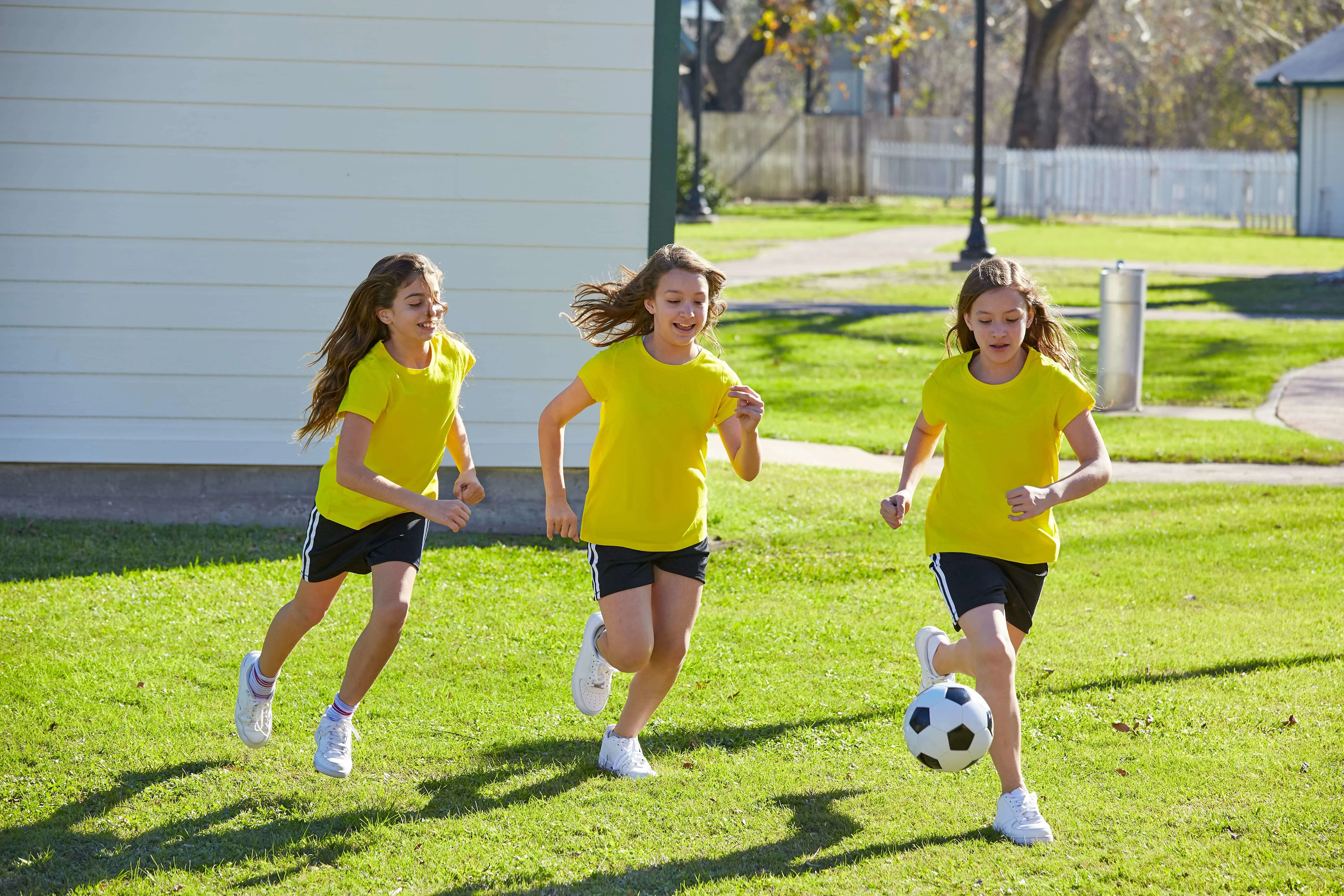 Young girls playing football