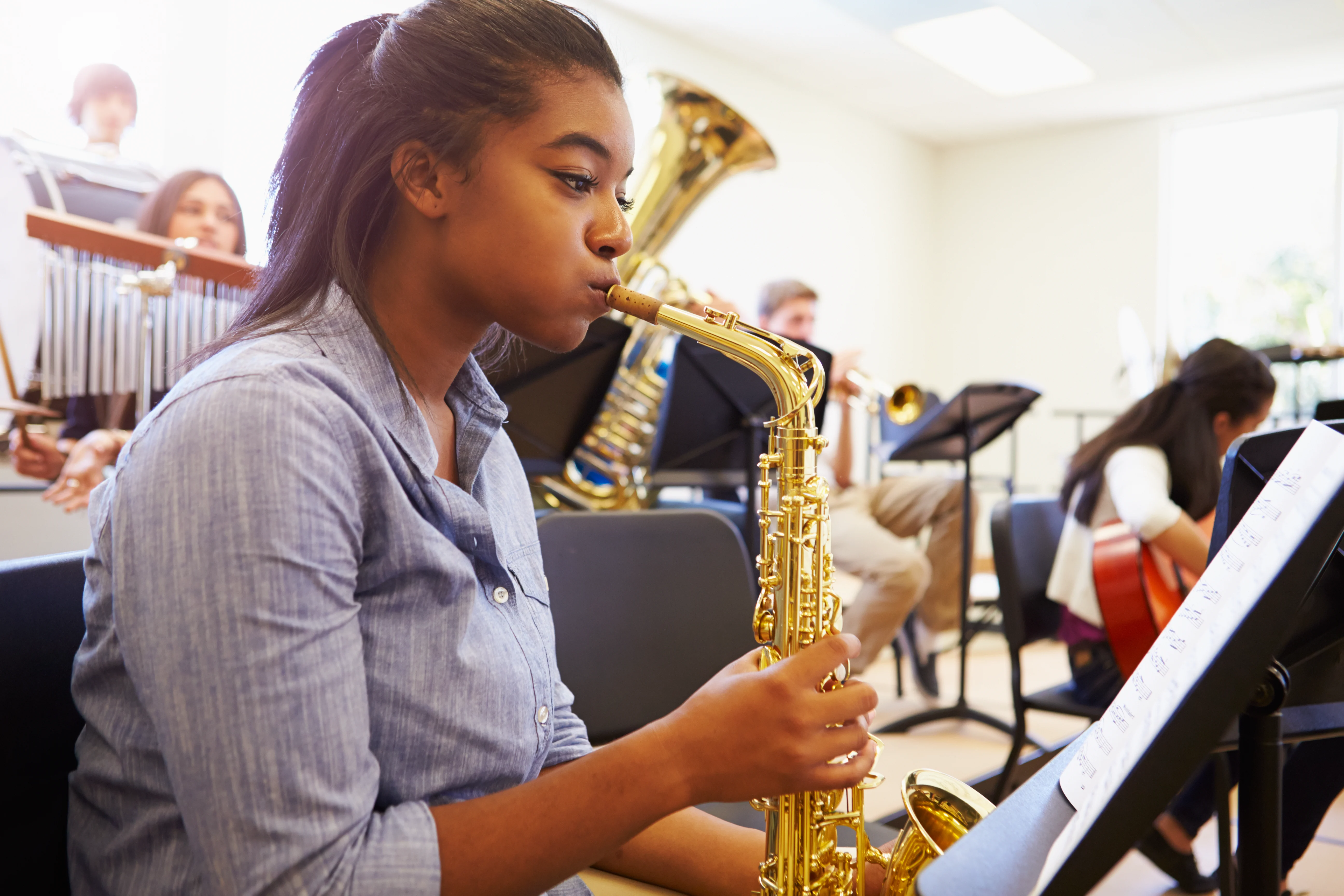 Girl playing a saxophone
