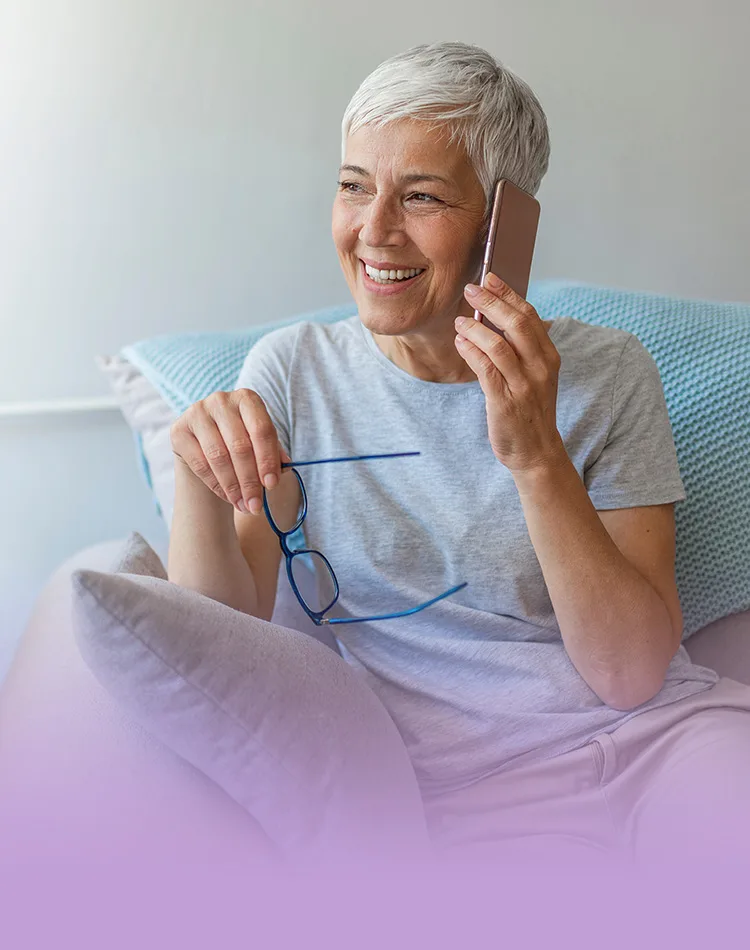 Smiling middle-aged woman talking on a mobile phone