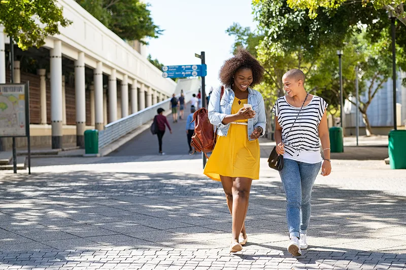 Two women walking down the street