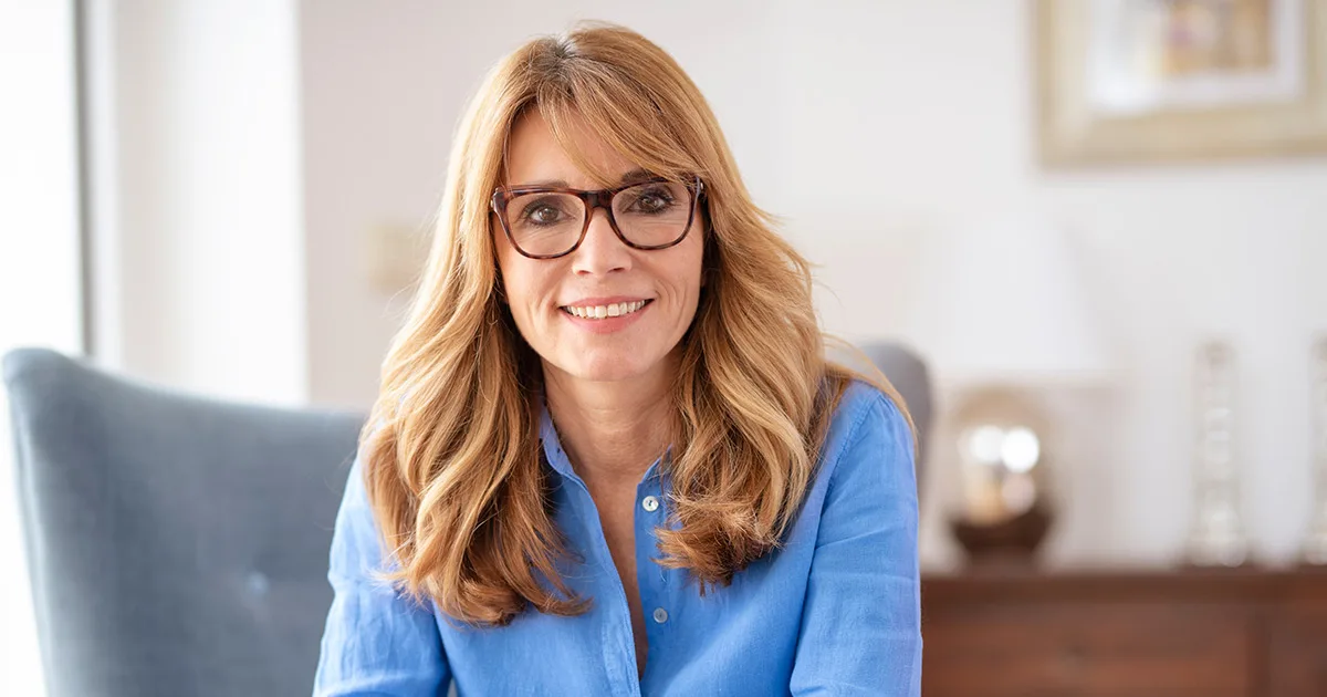 Brown haired middle aged woman with the glasses