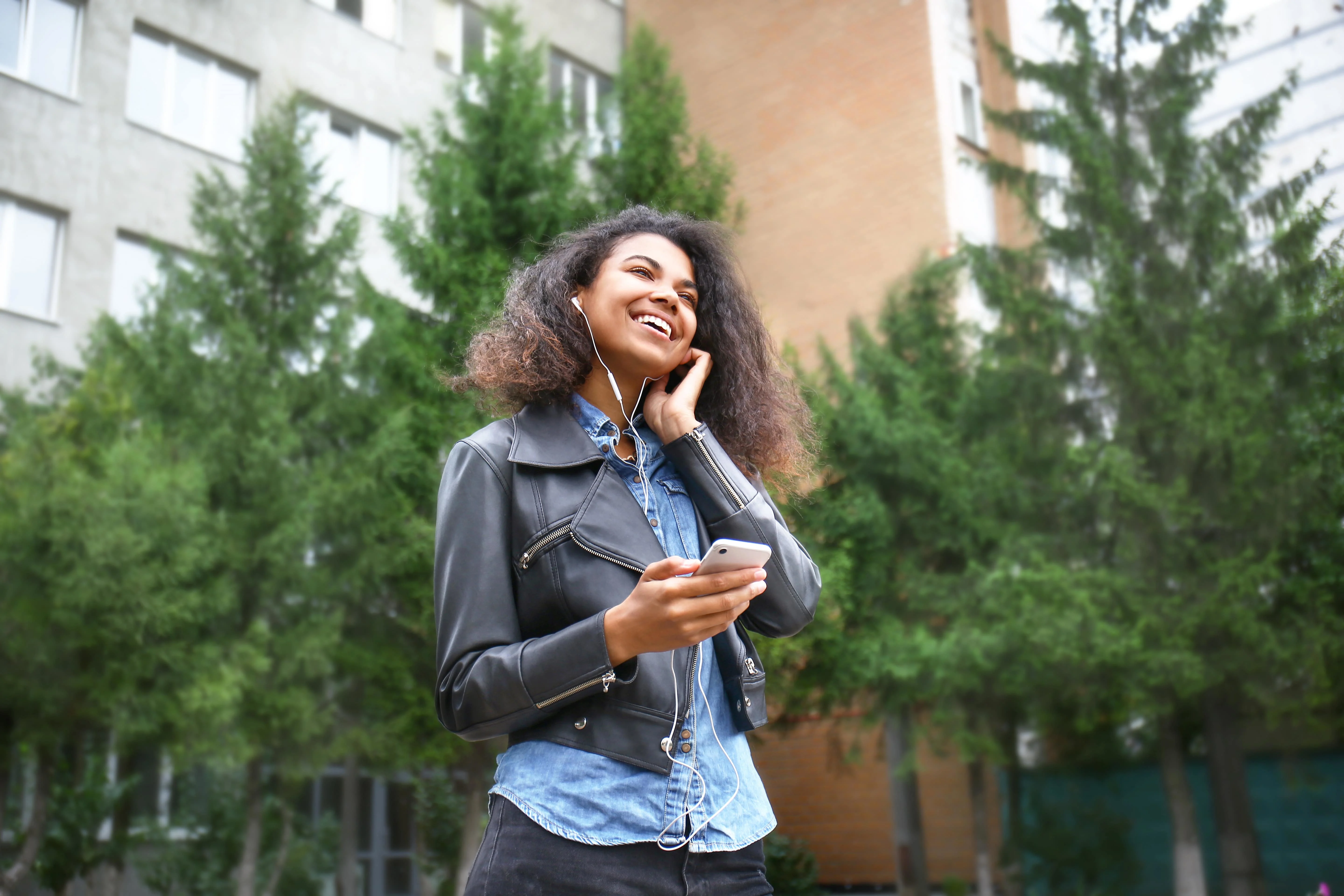 Girl smiling and holding her phone