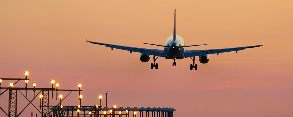 Airplane take off at sunset