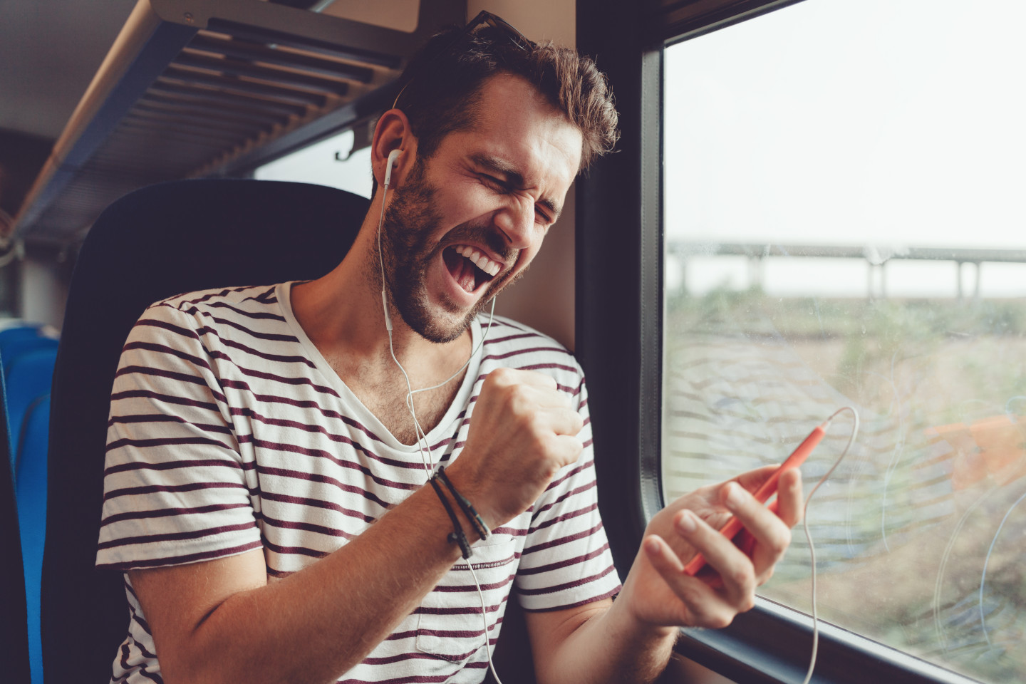 Its man. A man Listening to Music on a vehicle. Man Listening to Music in Train. Listening to the story about a young man.