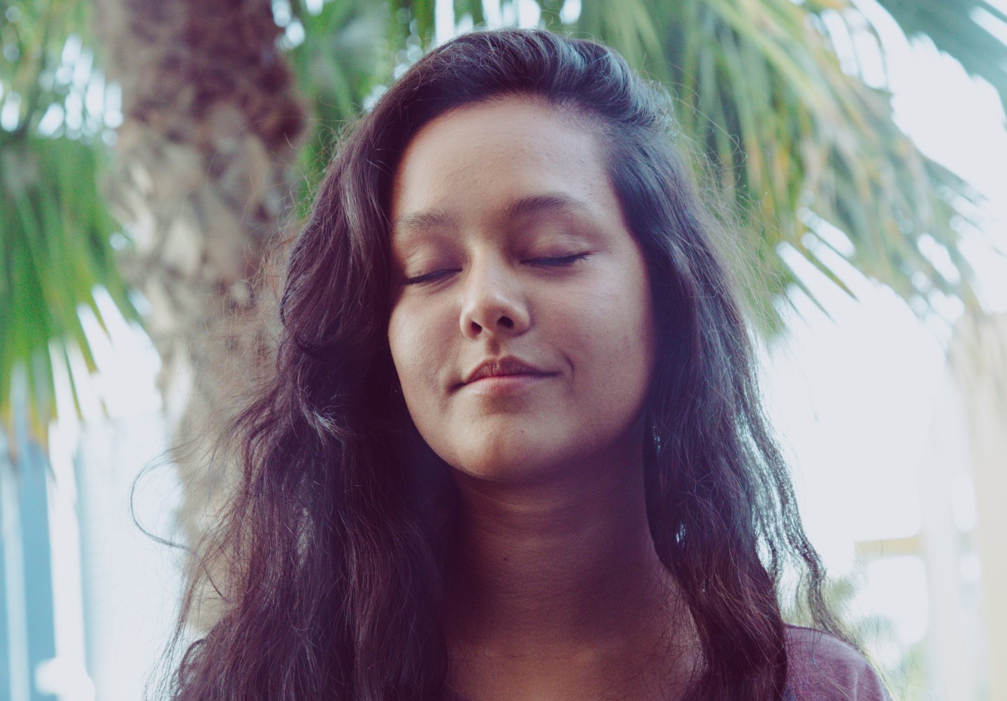 long-haired-woman-eyes-closed