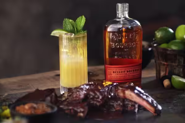 A glass of Bulleit Bourbon with tonic and ice.