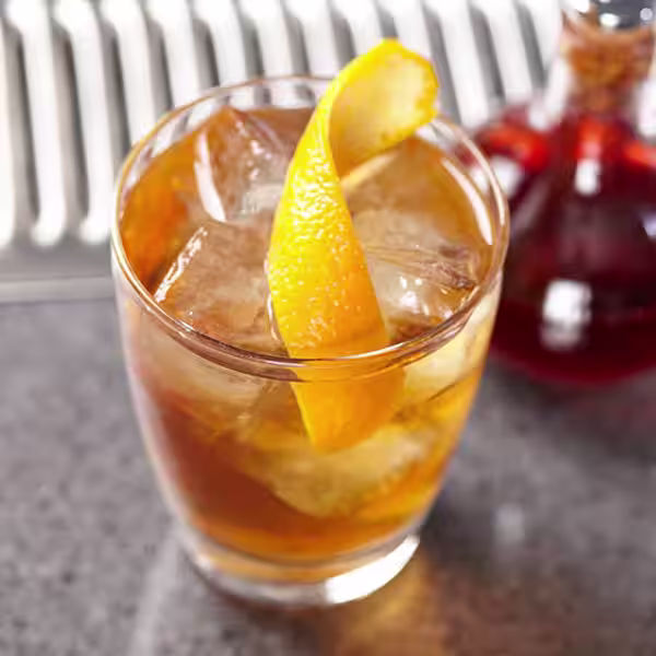 A glass of Bulleit Whiskey Sour. Click to find our recipe for Whiskey Sour