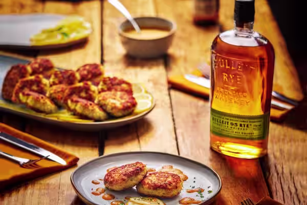 A glass of Bulleit Bourbon with tonic and ice.