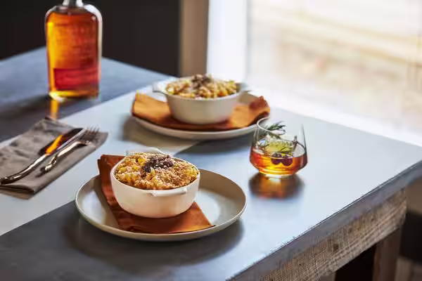 A glass of Bulleit Bourbon with tonic and ice. Click to find our recipe for bourbon with tonic