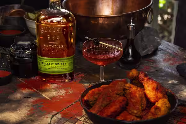 A glass of Bulleit Bourbon with tonic and ice.