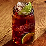 A glass of Bulleit and Cola. Click to find our recipe for Bulleit and Cola