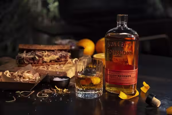 A glass of Bulleit Bourbon with tonic and ice.