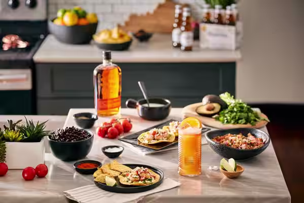 A glass of Bulleit Bourbon with tonic and ice.