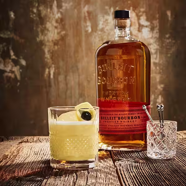 A glass of Bulleit Whiskey Bourbon Sour. Click to find our recipe for Whiskey Bourbon Sour
