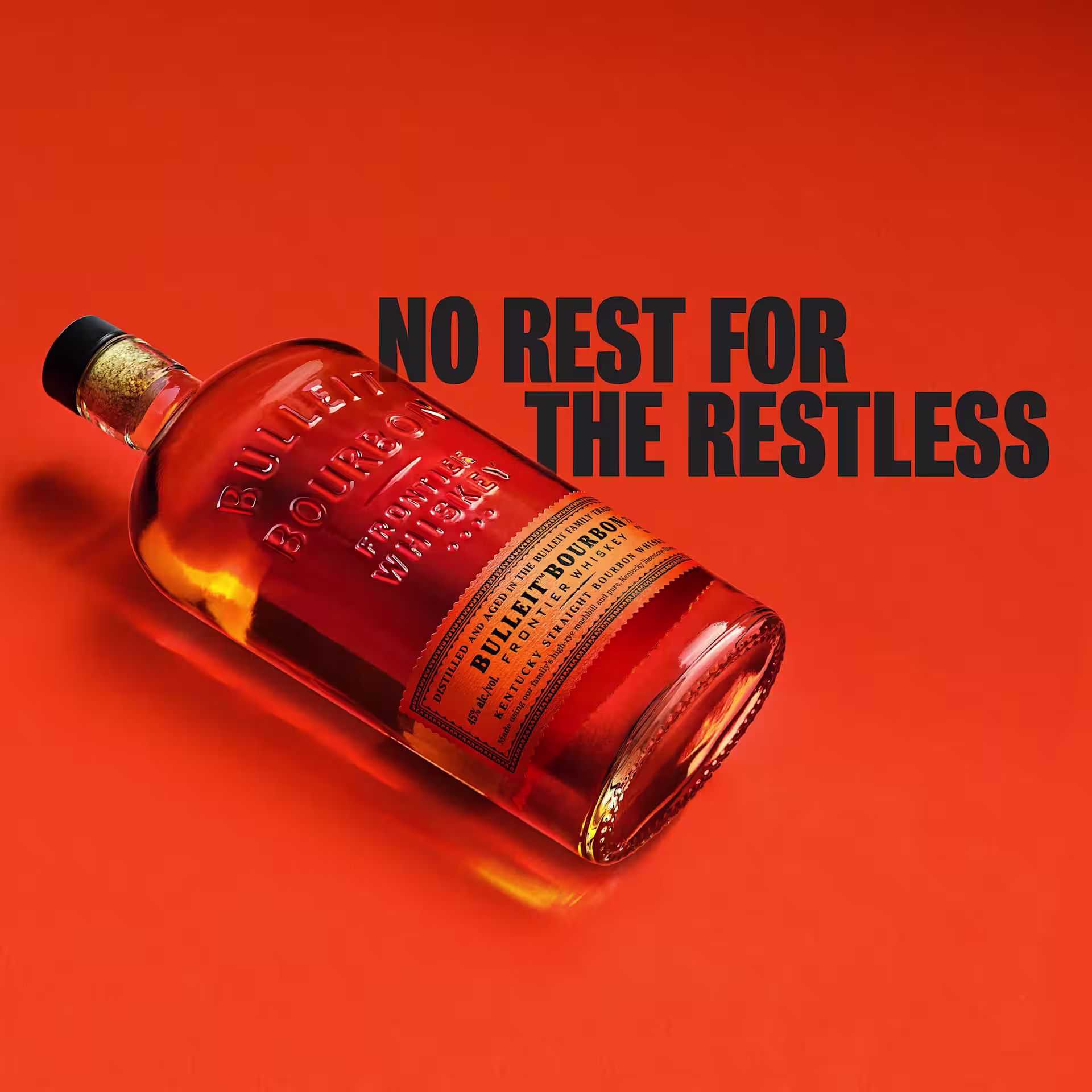 A bottle of Bulleit Bourbon with the text 'No Rest for the Restless'