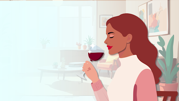 Woman enjoying a glass of wine to celebrate the holiday season