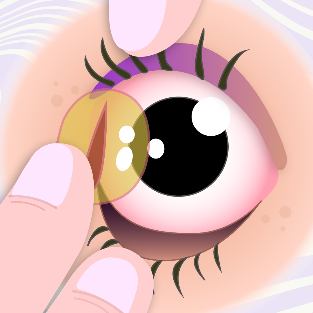 someone inserting a colored contact into thier eye