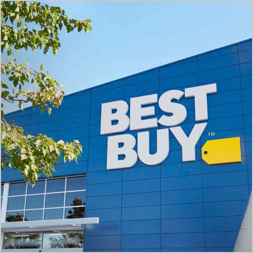 News - Best Buy storefront in front of a blue sky with the large yellow tag logo