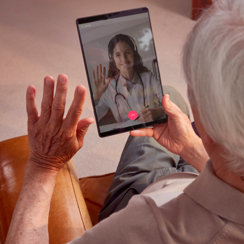 News - A man is speaking with his doctor via video call on a tablet