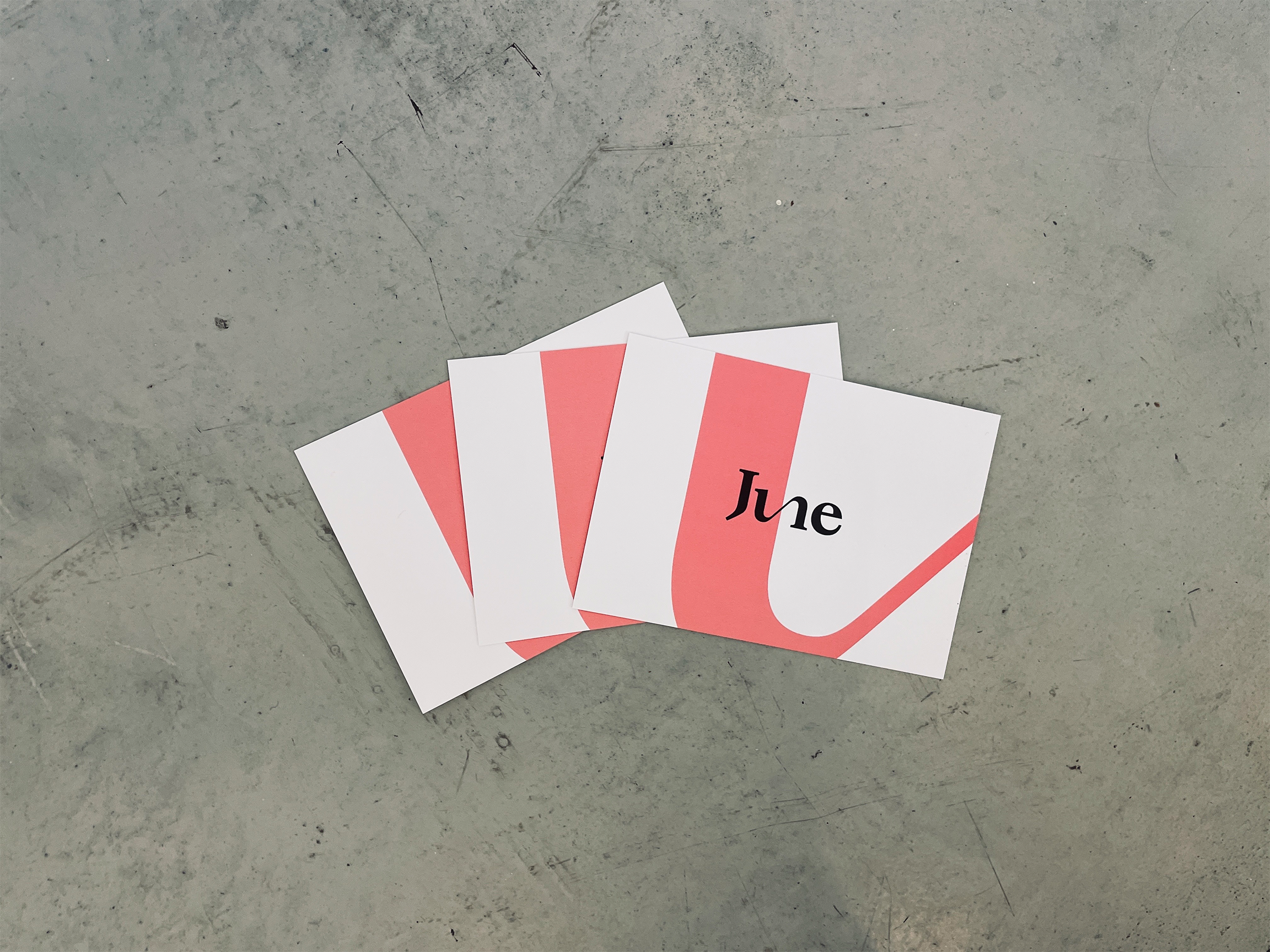 Image of three cards with the logo of JUNE Corporate Communications on it.