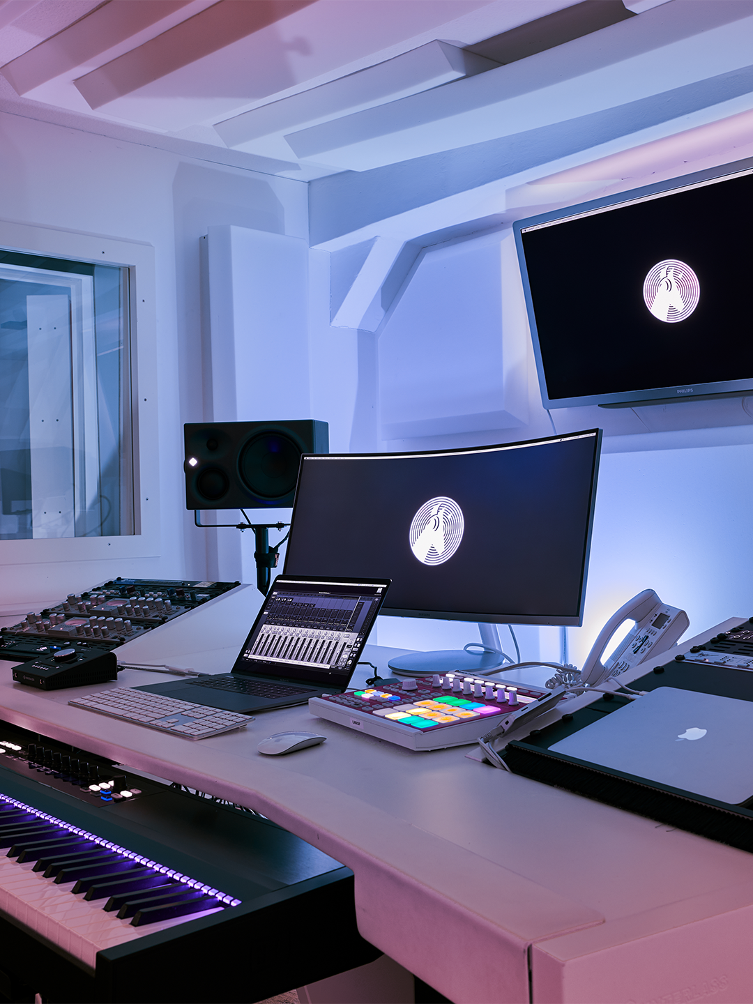 Picture from the inside of the White Horse Music studio. Mixer, laptop and sound system are visible.