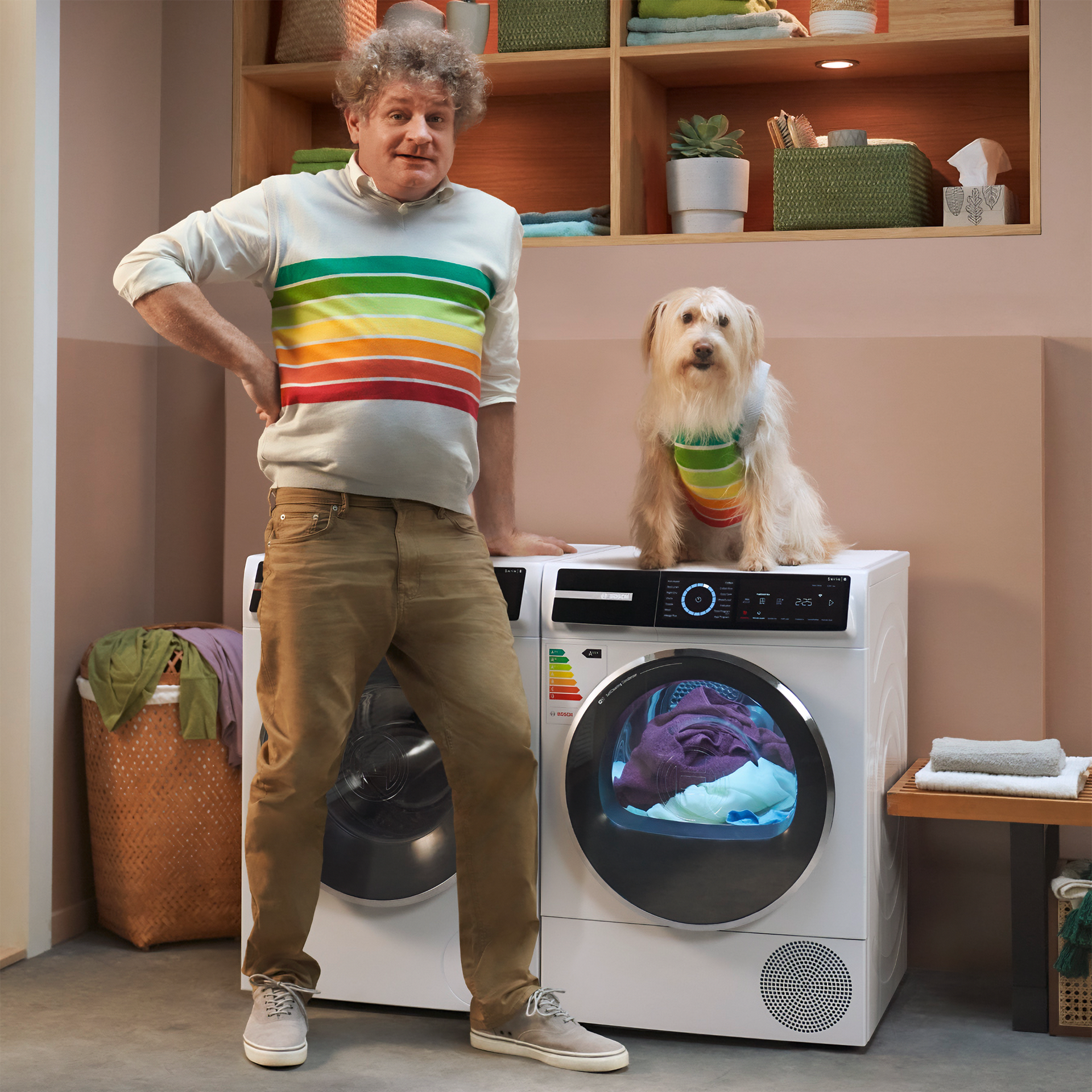 Image of a man with gray curls and a shaggy dog sitting on a washing machine for the "Like A Bosch" campaign. Both are wearing a top depicting the colors of the energy efficiency scale