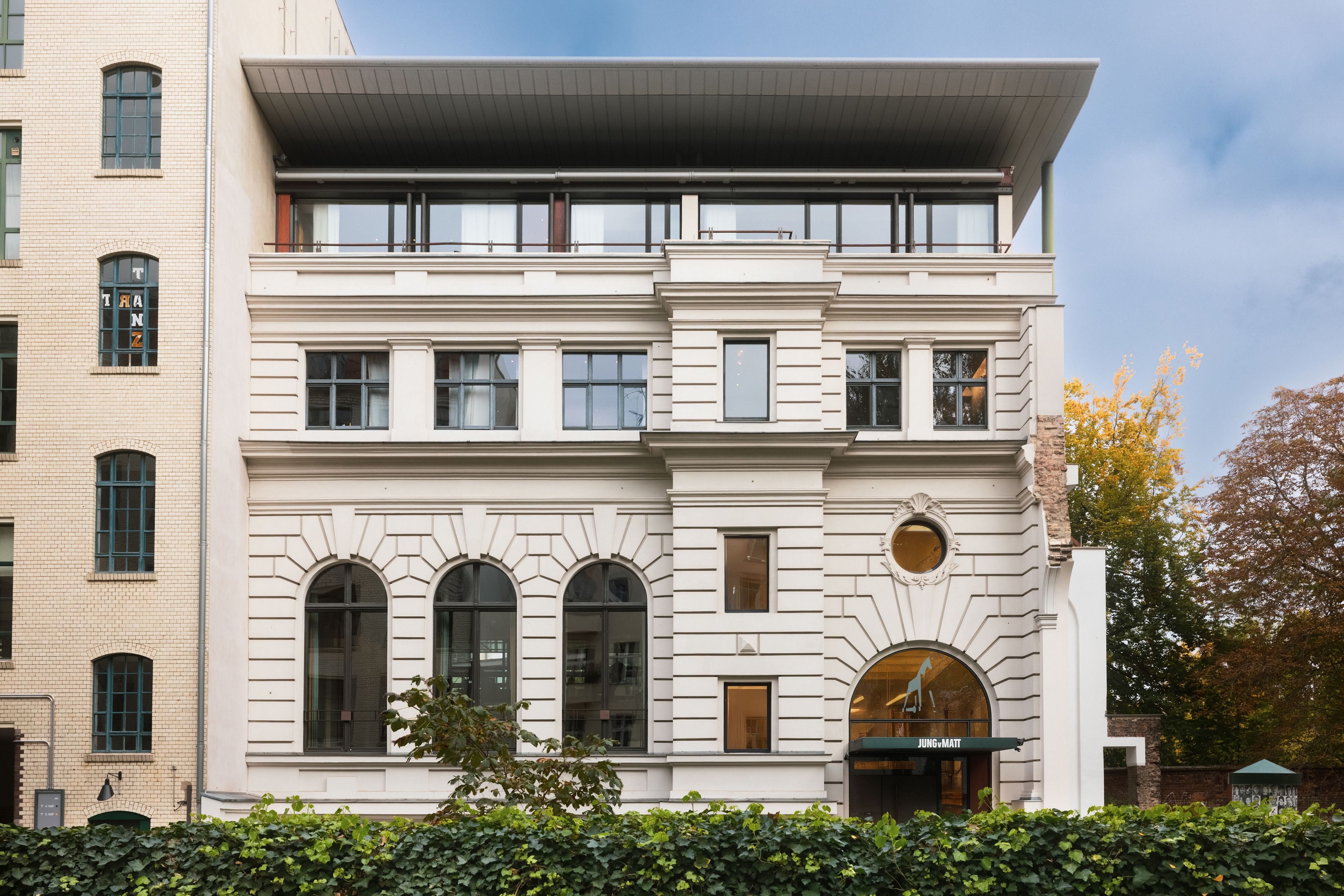 Image of the modern, magnificent Jung von Matt SPREE office building from the outside in Berlin-Kreuzberg.