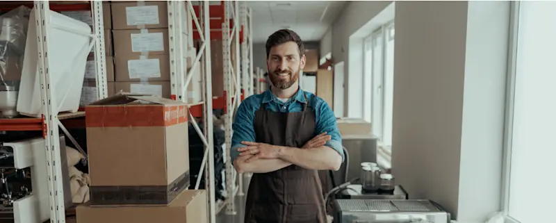 A business owner with a neatly organised premises thanks to self storage at STOREX