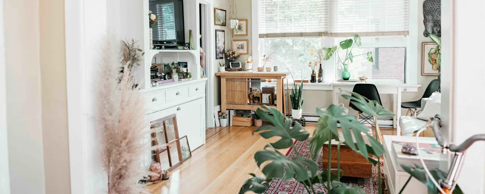 Feature Image A bright, airy living room with a mix of eco-friendly storage solutions