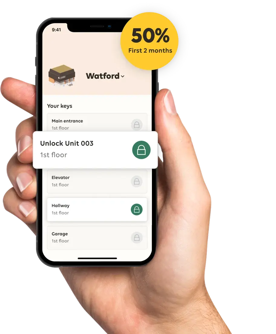 Hand holding phone with STOREX app.