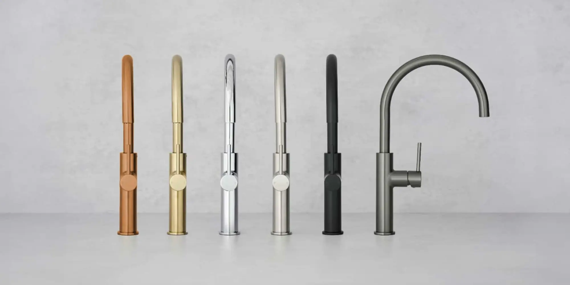 Six kitchen faucets in different finishes arranged in a row: bronze, gold, chrome, brushed nickel, black, and gunmetal.