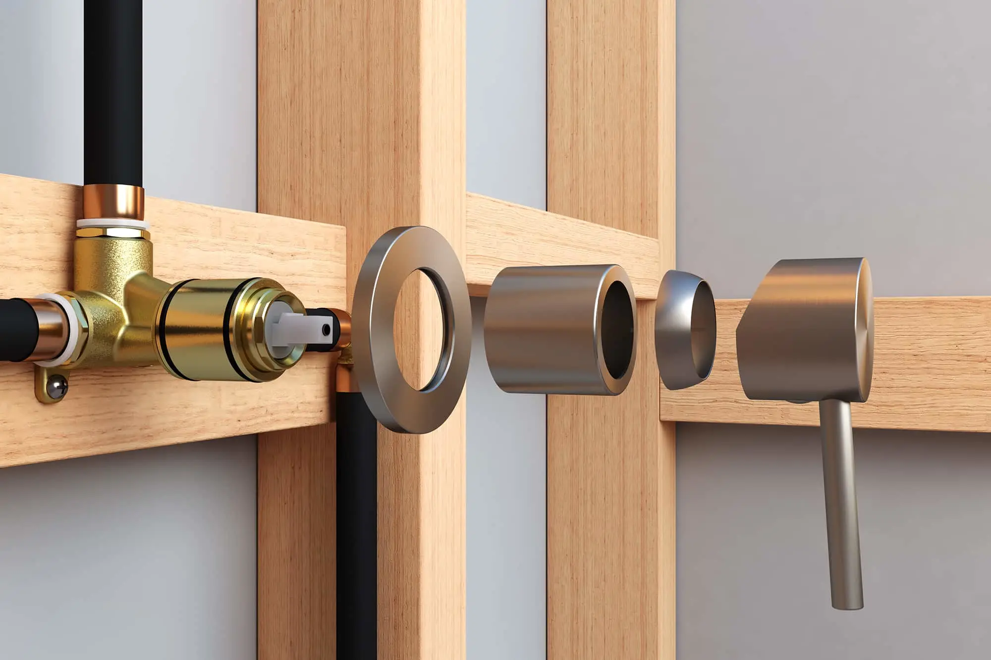 Disassembled shower mixer components displayed on wooden door frame showing brass valve and metal cylindrical parts.