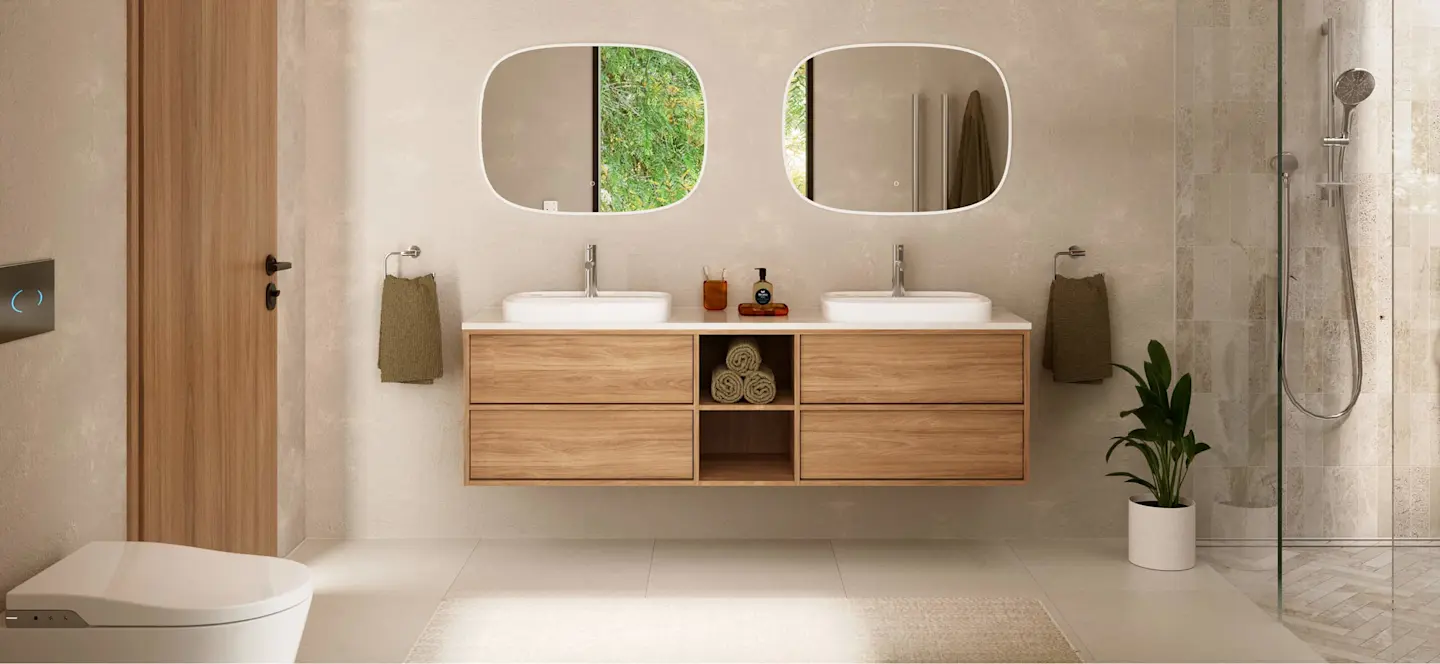 Modern bathroom with double vanity, wood cabinets, two rounded mirrors, white sinks, and glass shower enclosure.