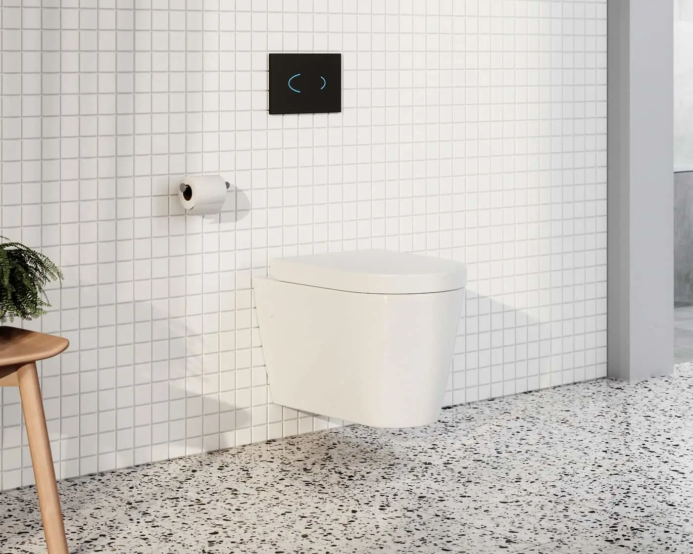 Modern bathroom with white wall-mounted toilet, white tile wall, terrazzo floor, and black flush panel.