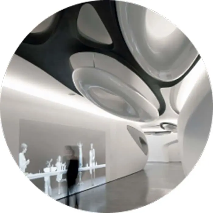 Modern white interior with curved walls and ceiling featuring black organic patterns and glass display table