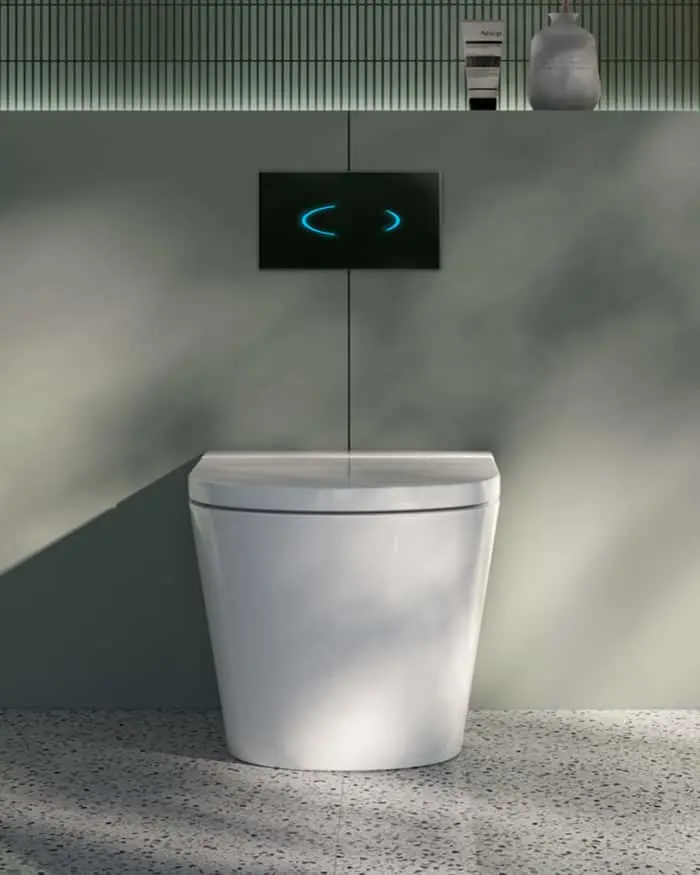 Modern white toilet with wall-mounted black control panel displaying blue symbols in a gray bathroom.
