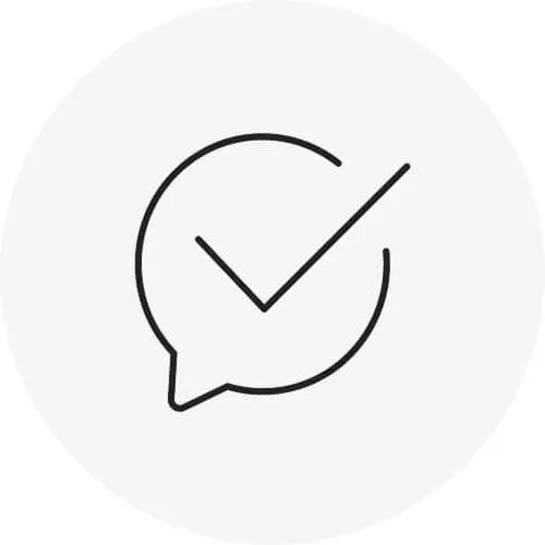 Black outline of a speech bubble with a checkmark inside on a light gray circular background.