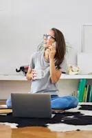woman drinking tea on the phone