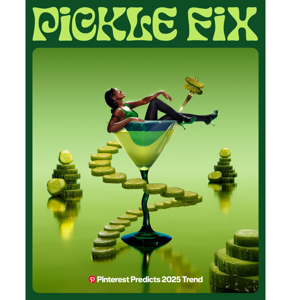 Woman in green dress reclines in martini glass with pickle garnish with stacks of pickles in the green background