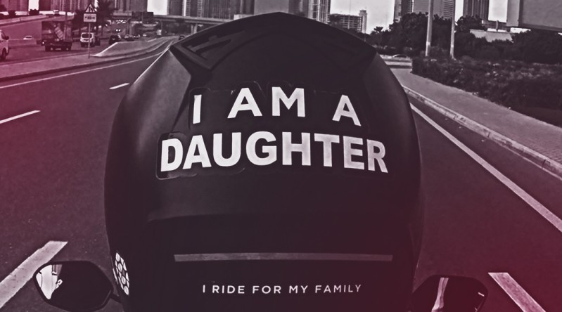 Motorcycle helmet with the words I AM A DAUGHTER on the back