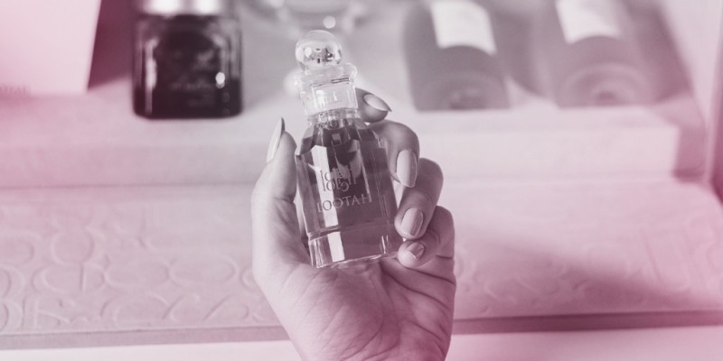 Woman holding lootah perfume