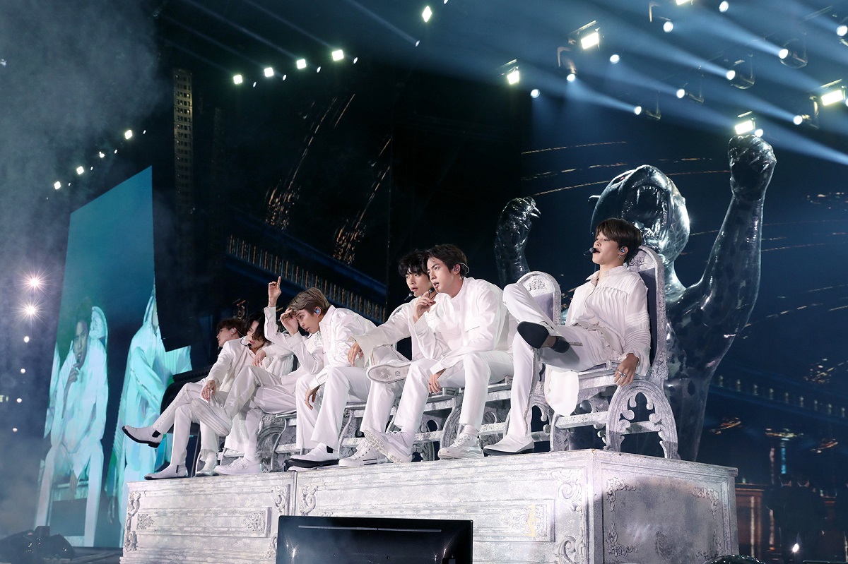 Screen showing band boys at concert