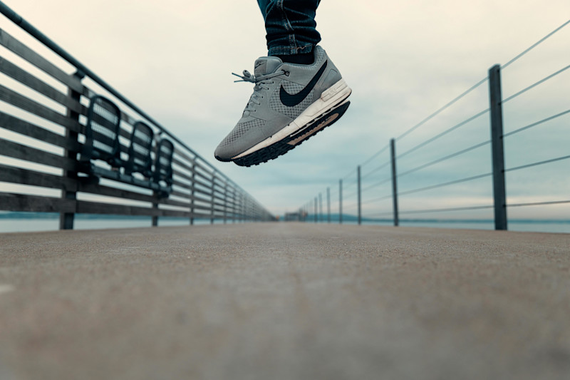 Nike runners on bridge